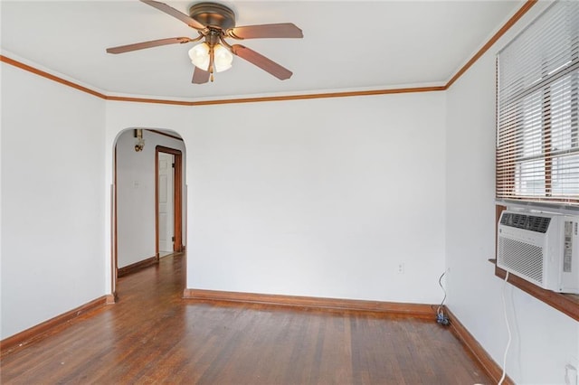 unfurnished room with dark wood-style floors, arched walkways, crown molding, cooling unit, and baseboards