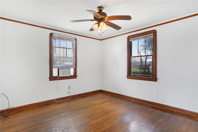 unfurnished room with baseboards, dark wood-style flooring, and crown molding