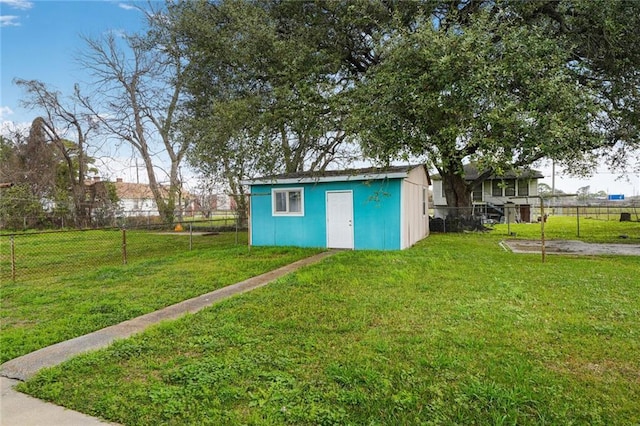 view of yard featuring an outbuilding, a storage shed, and fence