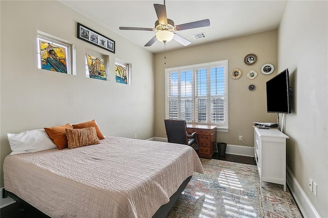 bedroom featuring visible vents, ceiling fan, and baseboards