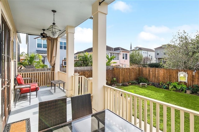 view of patio with a residential view, a fenced backyard, and ceiling fan