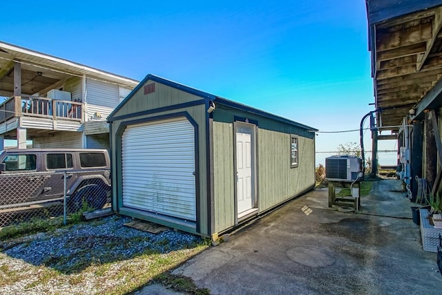 view of outbuilding featuring an outdoor structure and central AC unit