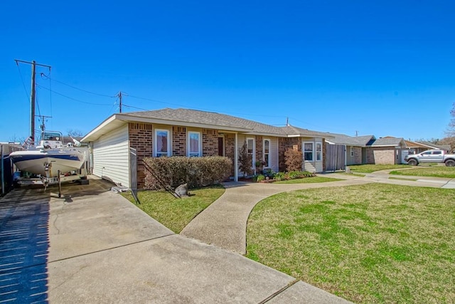 ranch-style home with a front lawn and brick siding