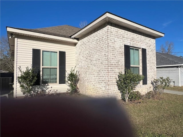 view of home's exterior featuring brick siding