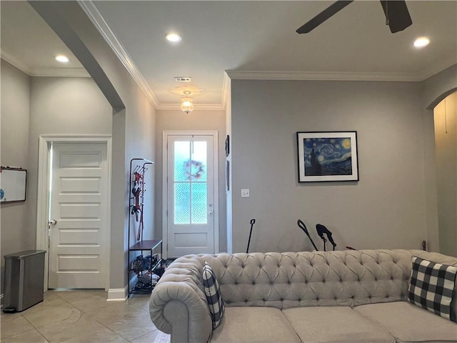 entrance foyer featuring recessed lighting, arched walkways, a ceiling fan, and ornamental molding