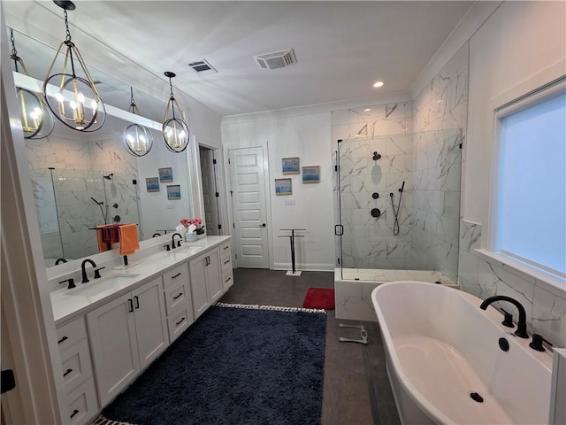 full bath featuring a freestanding tub, visible vents, a marble finish shower, and a sink