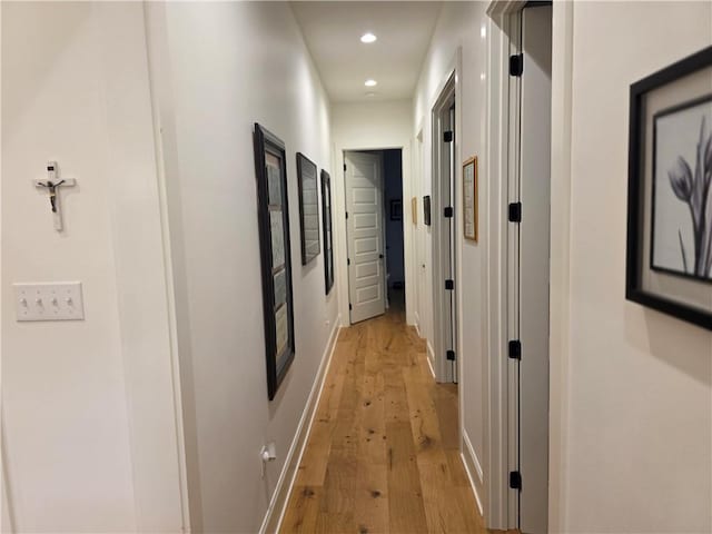 corridor featuring recessed lighting, baseboards, and light wood-style flooring
