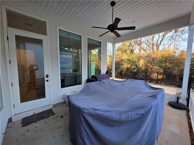 view of patio featuring ceiling fan, grilling area, and fence