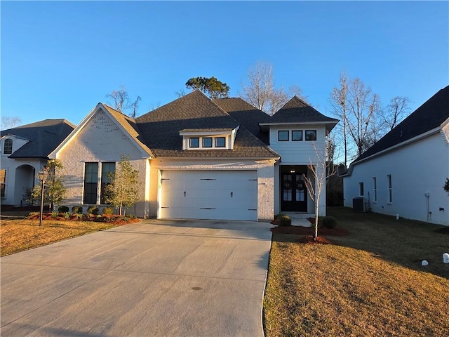 view of front of house with cooling unit, concrete driveway, a front lawn, and a shingled roof