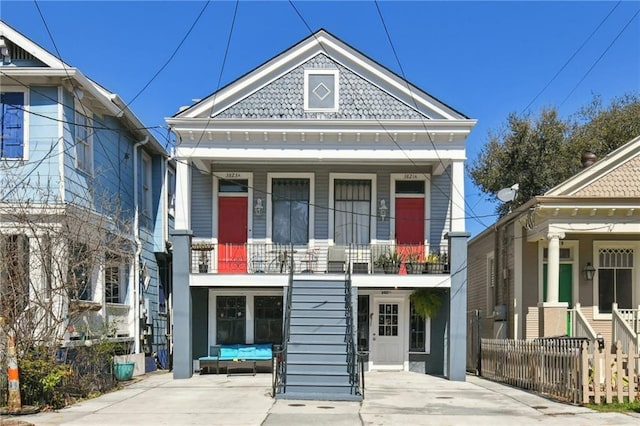 view of front of property with a porch and stairway