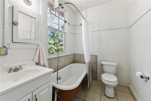 bathroom featuring toilet, tile patterned floors, curtained shower, a washtub, and vanity