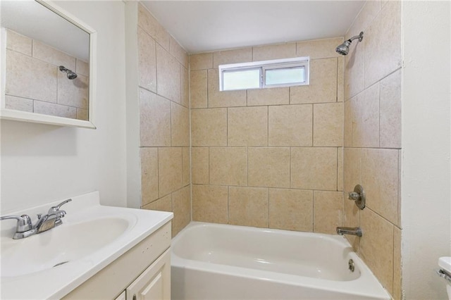 full bath featuring toilet, vanity, and bathing tub / shower combination