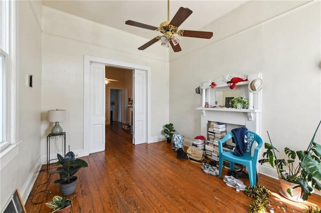 miscellaneous room with baseboards and wood finished floors