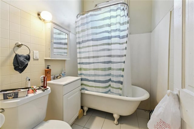 full bath featuring tasteful backsplash, toilet, shower / tub combo, vanity, and tile patterned flooring