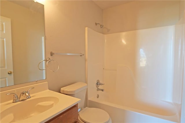 bathroom featuring toilet, shower / bath combination, and vanity