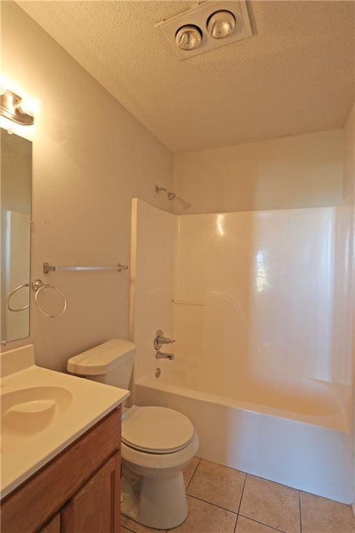 full bath with toilet, a textured ceiling, vanity,  shower combination, and tile patterned floors