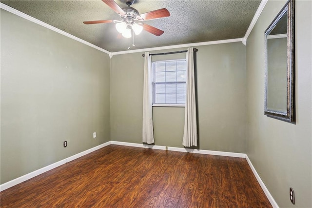 spare room featuring crown molding, a textured ceiling, and wood finished floors