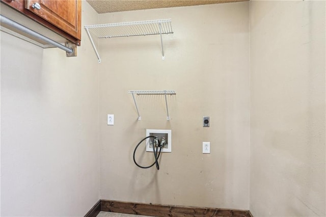 laundry area featuring washer hookup, cabinet space, and electric dryer hookup