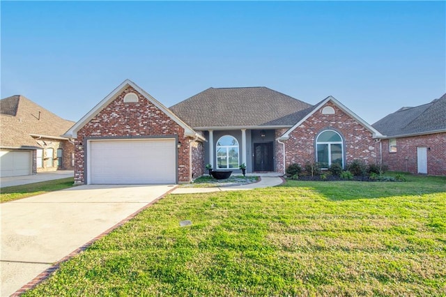 ranch-style house featuring driveway, an attached garage, a front lawn, and brick siding