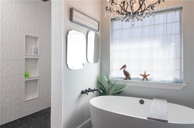 bathroom featuring a freestanding bath and walk in shower