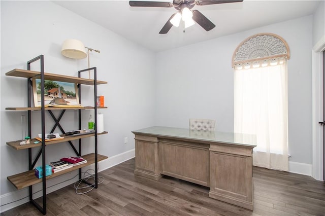 office featuring dark wood-style floors, baseboards, and a ceiling fan