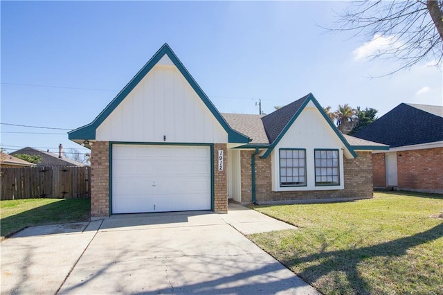 view of front of home featuring brick siding, a front yard, fence, a garage, and driveway