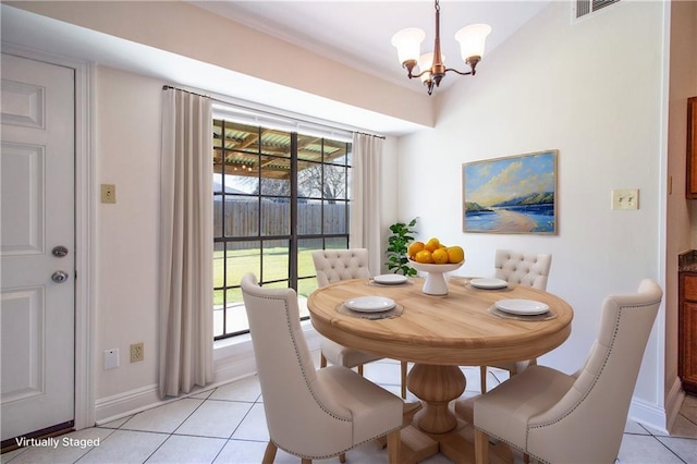 dining space featuring light tile patterned floors, a chandelier, visible vents, and baseboards