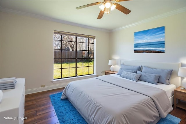 bedroom with dark wood-type flooring, crown molding, baseboards, and ceiling fan