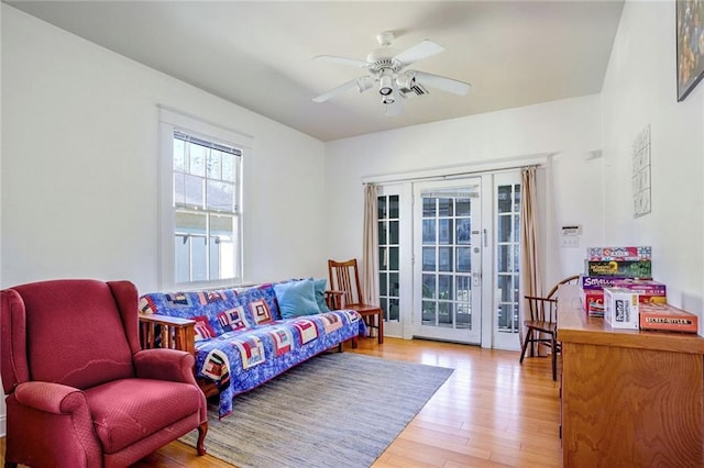 sitting room featuring a ceiling fan and wood finished floors