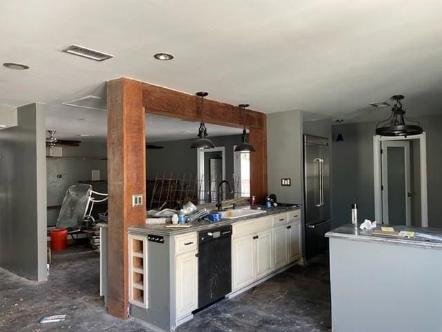 kitchen with dishwasher, concrete flooring, a sink, and high end fridge