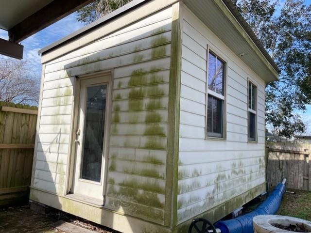 view of home's exterior with fence