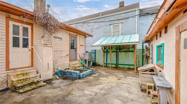 view of patio / terrace featuring entry steps and fence