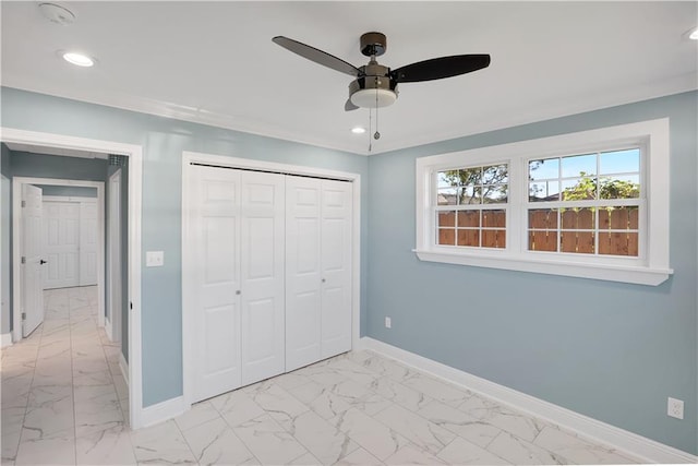 unfurnished bedroom with marble finish floor, baseboards, and recessed lighting