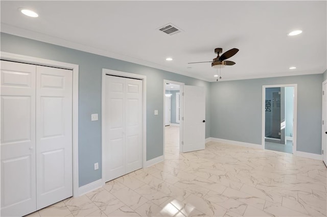 unfurnished bedroom featuring visible vents, baseboards, two closets, recessed lighting, and marble finish floor