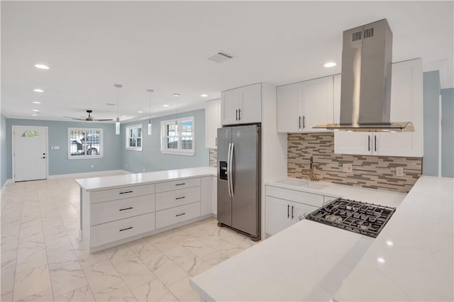 kitchen with island exhaust hood, a peninsula, stainless steel refrigerator with ice dispenser, marble finish floor, and a sink
