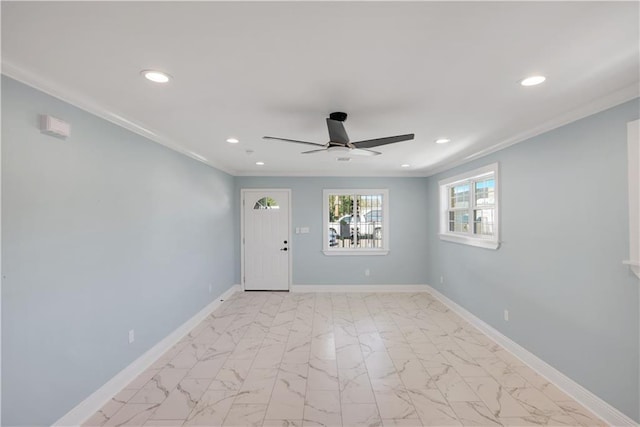 interior space featuring recessed lighting, baseboards, a ceiling fan, and ornamental molding