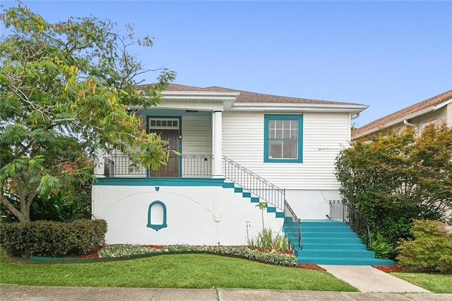 4500 S Rocheblave St, New Orleans, LA 70125 - view of front of property featuring stairway, a porch, and a front lawn