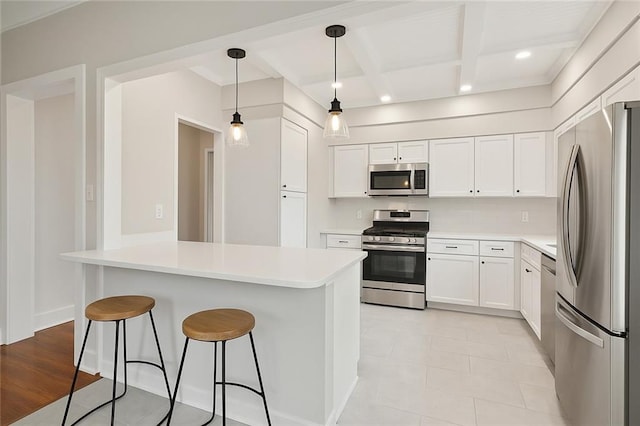 4500 S Rocheblave St, New Orleans, LA 70125 - kitchen with stainless steel appliances, a breakfast bar, white cabinetry, beam ceiling, and light countertops
