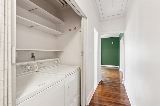 4500 S Rocheblave St, New Orleans, LA 70125 - laundry room with attic access, washing machine and clothes dryer, dark wood-style flooring, and baseboards