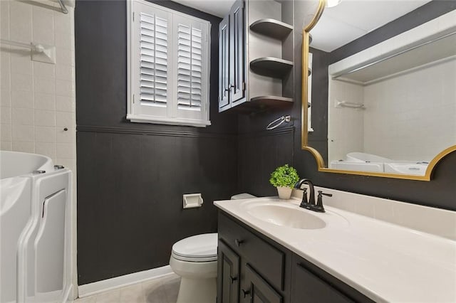 bathroom featuring tile patterned flooring, a washtub, toilet, vanity, and a shower