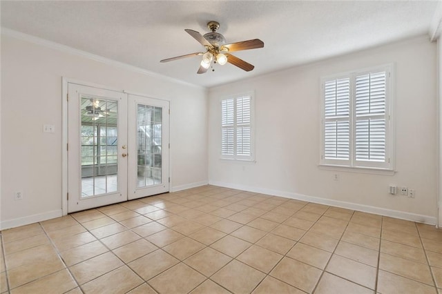 spare room with light tile patterned floors, baseboards, ceiling fan, ornamental molding, and french doors