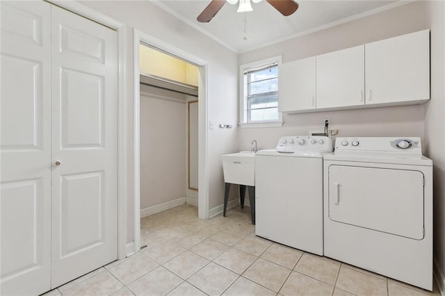 laundry area featuring cabinet space, light tile patterned floors, washer and clothes dryer, and a ceiling fan