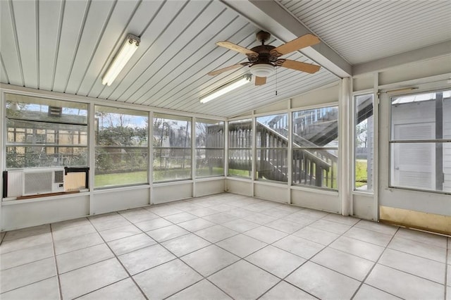 unfurnished sunroom with vaulted ceiling with beams, ceiling fan, plenty of natural light, and cooling unit