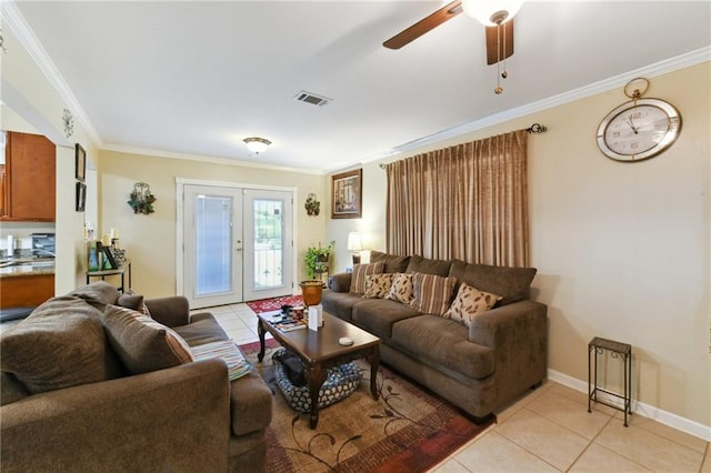 living room featuring ornamental molding, french doors, light tile patterned floors, and visible vents