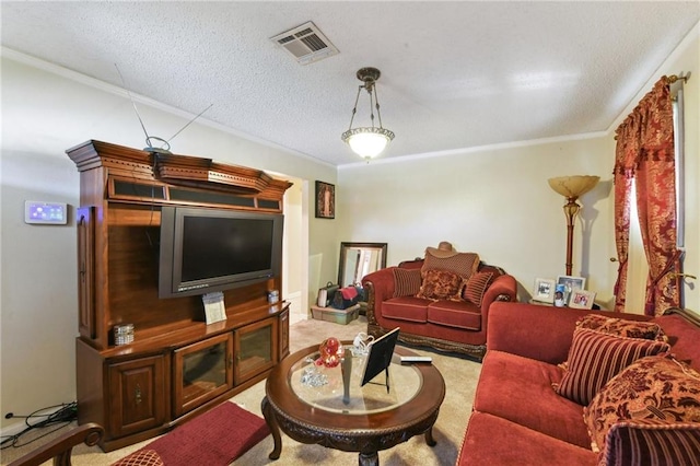 living area with a textured ceiling, ornamental molding, carpet flooring, and visible vents