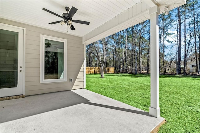 view of patio / terrace with fence and a ceiling fan