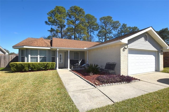 single story home featuring an attached garage, a front lawn, a porch, and brick siding