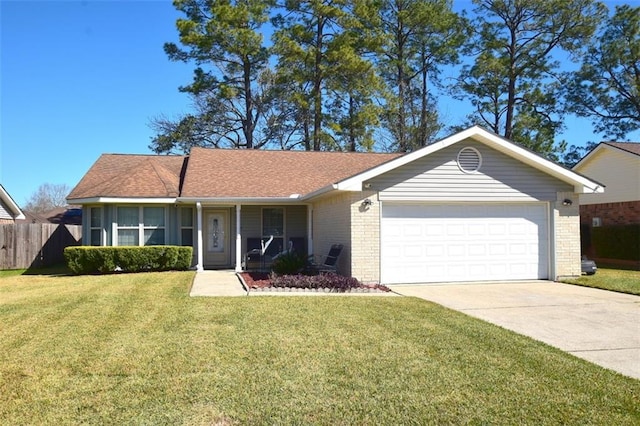 ranch-style home with driveway, a garage, fence, a front lawn, and brick siding