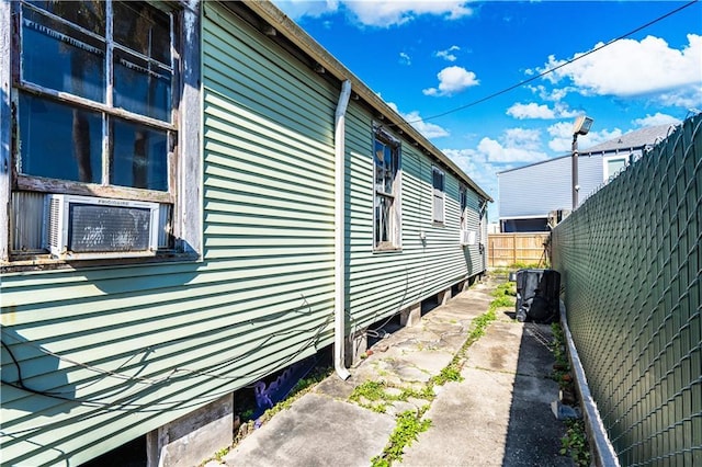 view of property exterior with fence