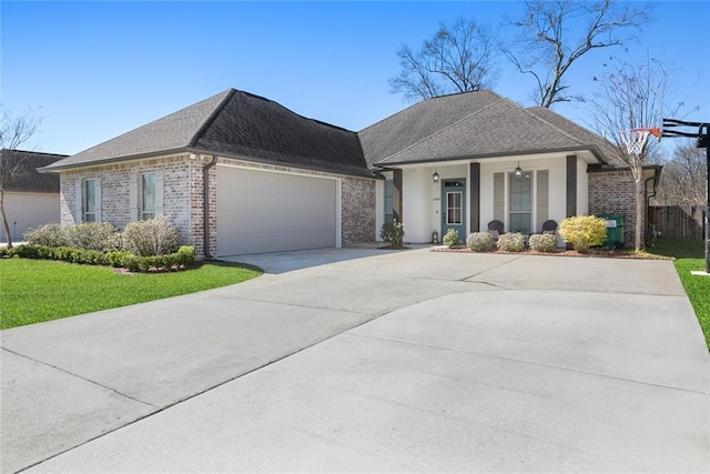 view of front of house with an attached garage, concrete driveway, and brick siding